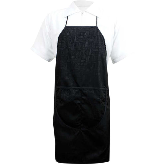 Sewicob Vincent Heat Stamp Apron in black with modern geometric pattern and front utility pockets worn over a white dress shirt