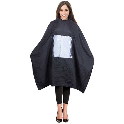 A woman modeling a black salon cape with a clear plastic front pocket, set against a plain white background.