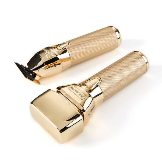 Two gold-colored professional hair clippers shown on a clean white background, one displaying the clipper head and the other showing the main handle with the brand name 'FXONE' visible.
