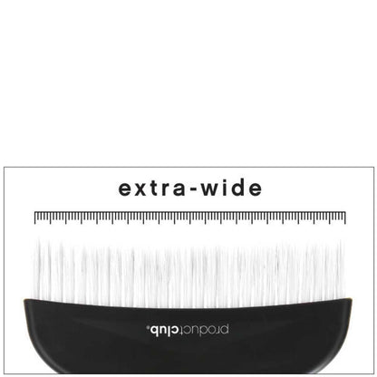 A close-up of an extra-wide eyelash extension brush with a black handle and white synthetic lashes, shown against a white background with a measurement ruler printed above.