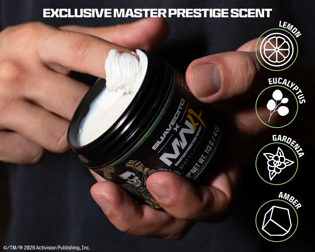 A person holds an open jar of Suavecito x MW white pomade with exclusive master prestige scent.