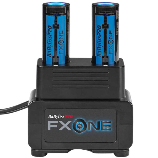 A black FX ONE dual-battery charger with two blue and black BabylissPRO FX ONE batteries inserted, shown on a white background.