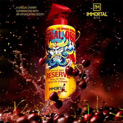 Bottle of Immortal NYC cologne with cherries on a dark background