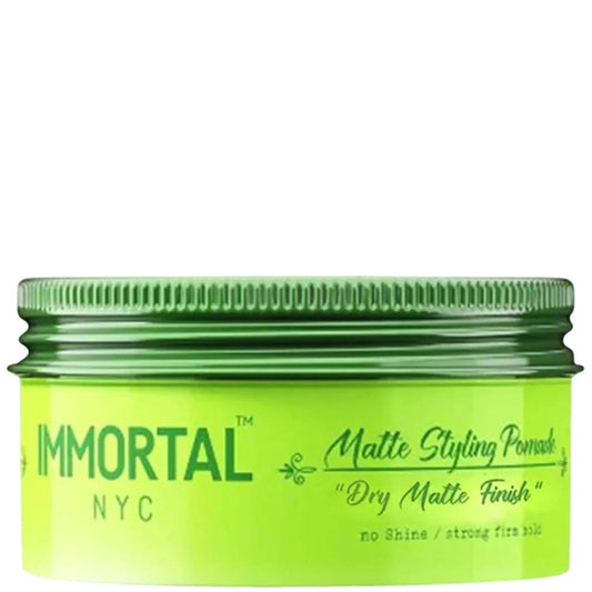 Green jar of Immortal NYC Matte Styling Pomade on a white background