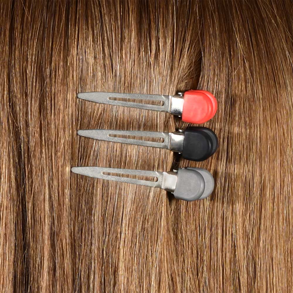 Set of hair clips on a background of brown hair