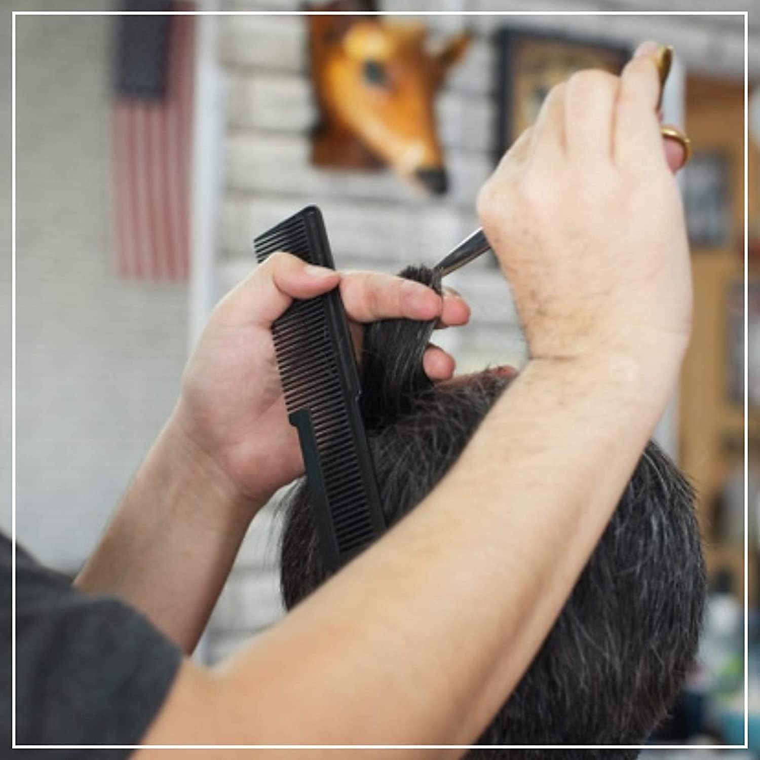 A professional Wahl Large Styling Comb showcasing a unique two-in-one design, featuring widely spaced, durable teeth on the top half for effortless hair sectioning, and fine, densely packed teeth on the bottom half for tight control and detailed clipper work. | BeauBar Supply