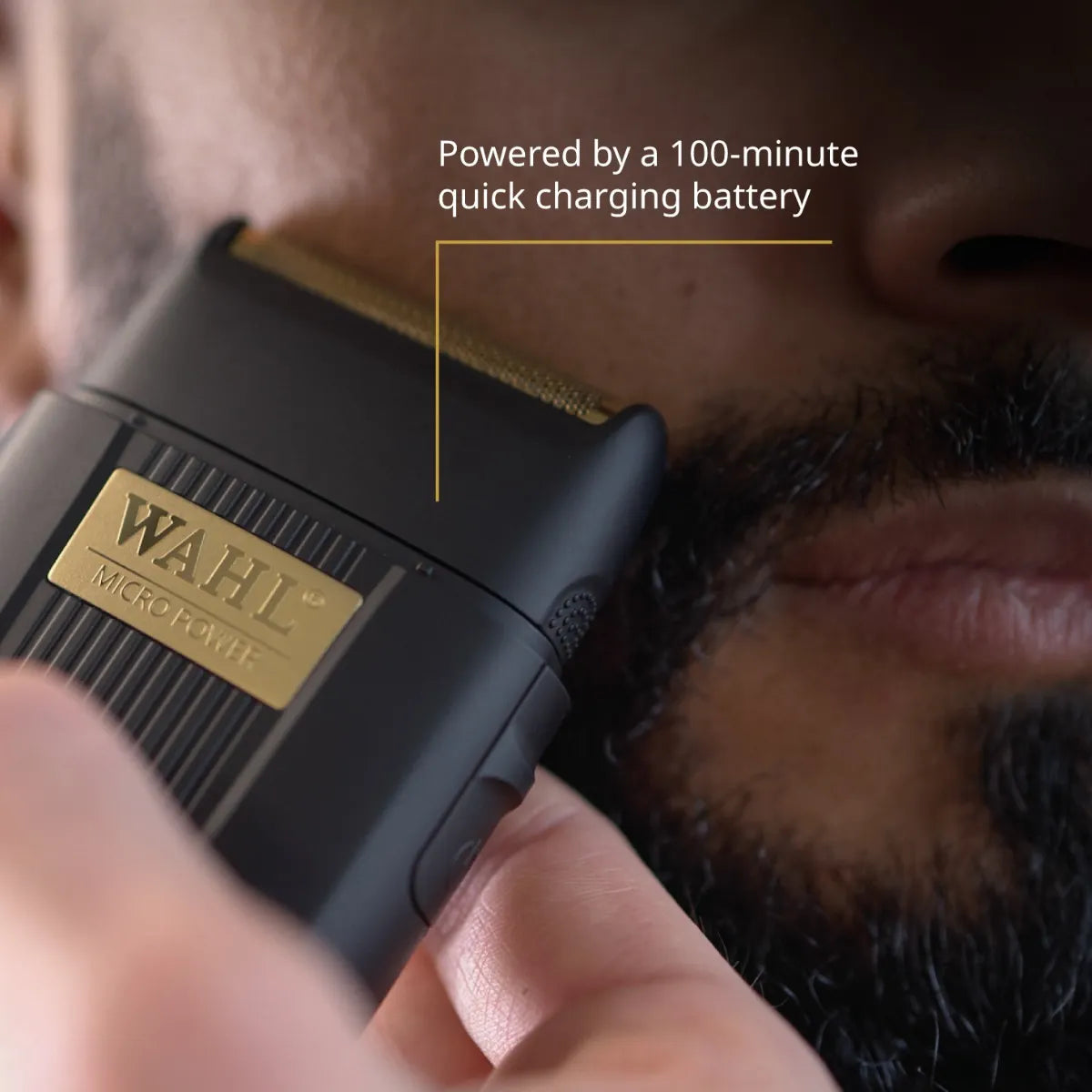 Wahl micro trimmer being used on a person's beard with text about battery life.