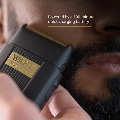 Wahl micro trimmer being used on a person's beard with text about battery life.