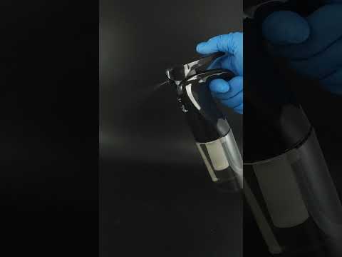 Hand using a continuous spray atomizer with ultra-fine mist and leak-proof design